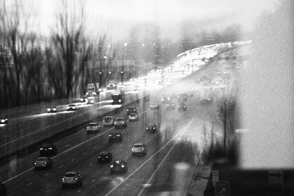 Moody black and white image of busy highway traffic in SeaTac, Washington.