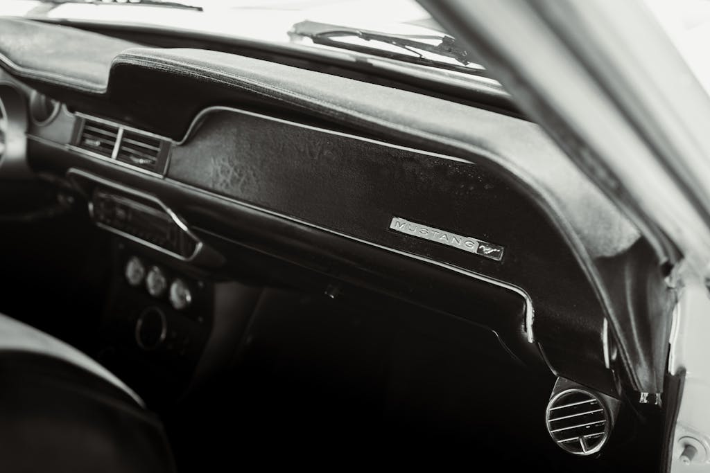 Black and white interior of a classic Mustang car, captured in Los Angeles for automotive enthusiasts.