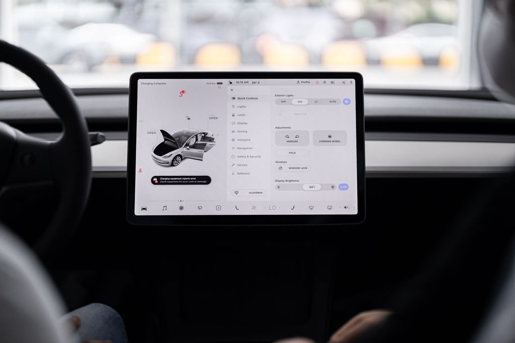View of a modern car's dashboard featuring a digital display panel with control options.
